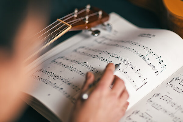 woman studying a musical score